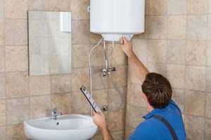 Plumber Checking Electric Boiler