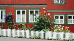 fenced red house