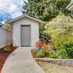 Backyard small shed and flower bed view