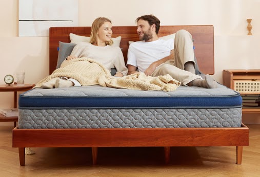 couple laying on a bed