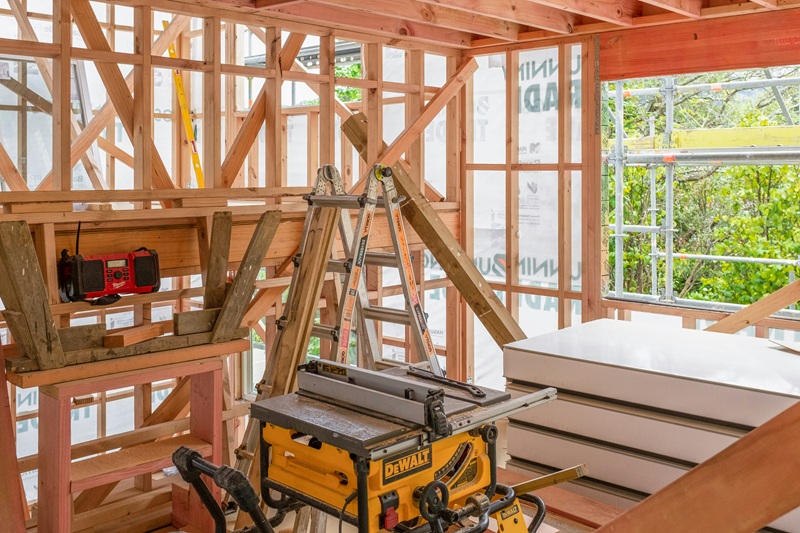 Construction site showing wood framework and tools