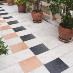 Elegant garden pathway with potted plants and tiled design