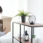 man holding a box moving to a new home