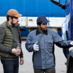 two men checking the truck