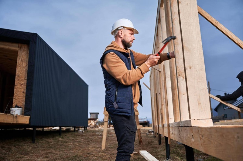 construction worker working on a shed
