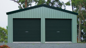 green garage shed with 2 roller doors