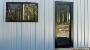 steel shed with a glass pa hinge door