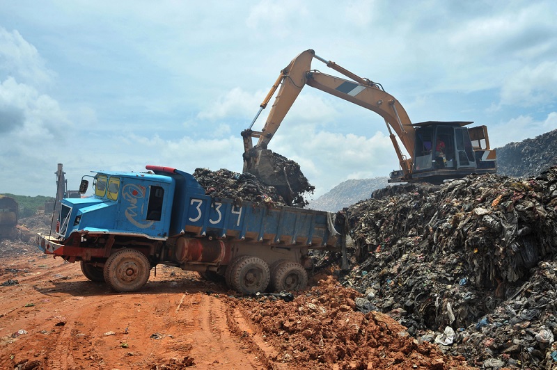 Garbage Trucks work on the landfill