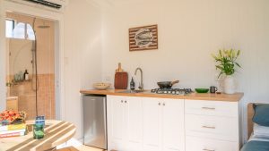 Interior White Cabin Wide Kitchen
