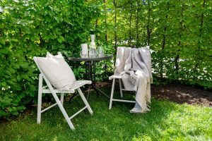 Chairs with Pillows Outside on Grass