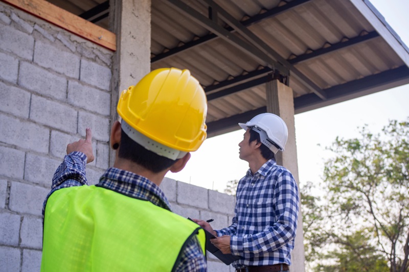 The inspectors are examining the structure of the house
