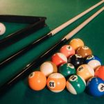Billiard table with green surface and balls