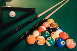 Billiard table with green surface and balls