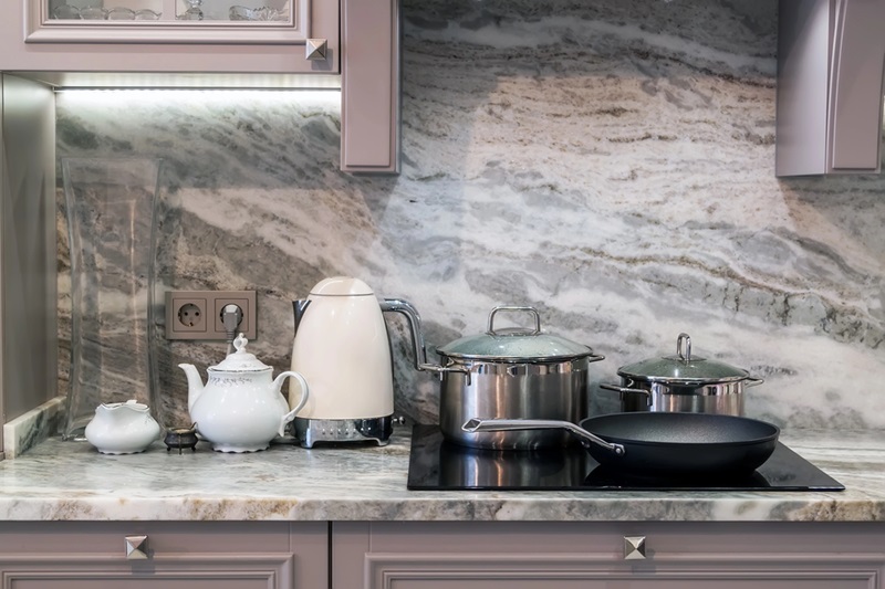 Closeup of custom designed kitchen, with marble looking quartz