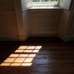 Light from glass window on wood floor