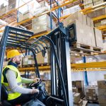 Warehouse man worker with forklift