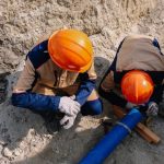 Workers are installing water supply pipeline system