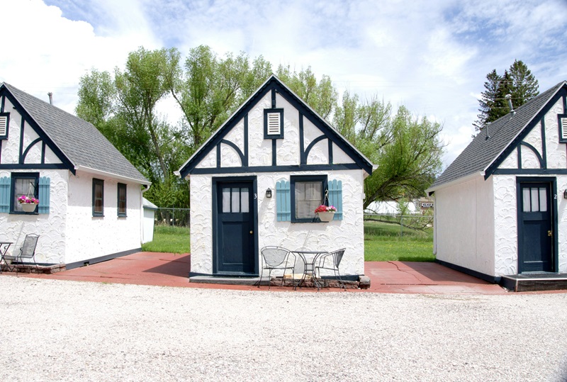 tudor-style cottages feature white textured walls with dark timber framing