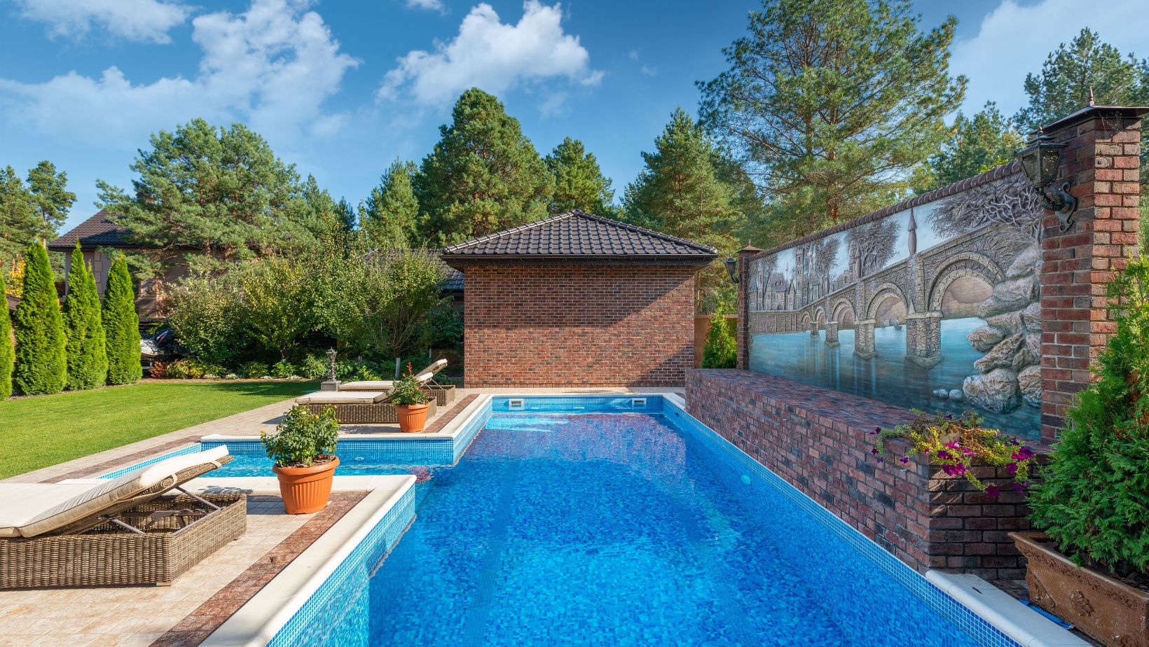 Brick house featuring a private swimming pool, garden, and mural painting for serene living