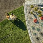 Top-Down View of a Landscaper Laying Fresh Sod Turf