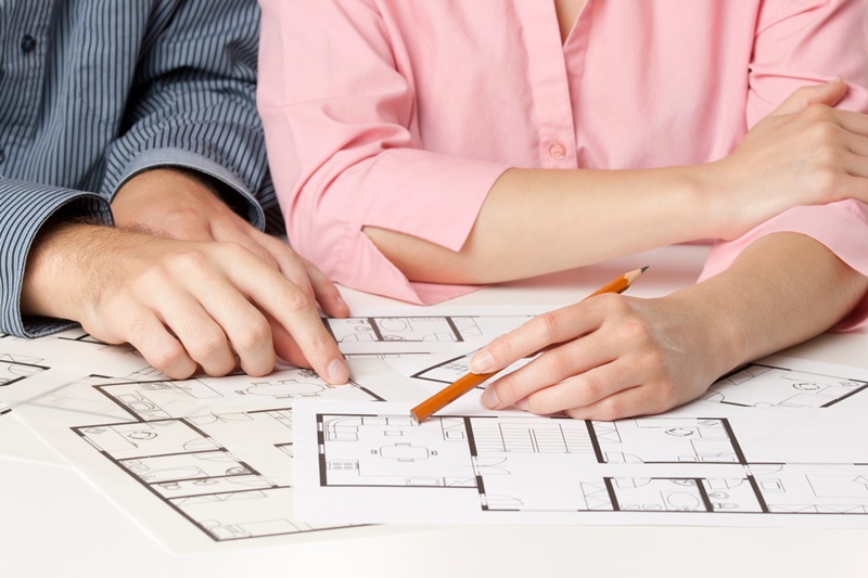 Young couple planning living together in new house Young couple planning living together in new house