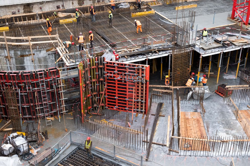 Active High-Rise Building Construction Site with Rebar and Formwork