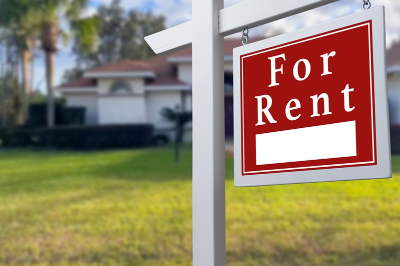 Home for Rent Sign in front of a House Home for Rent Sign in front of a House