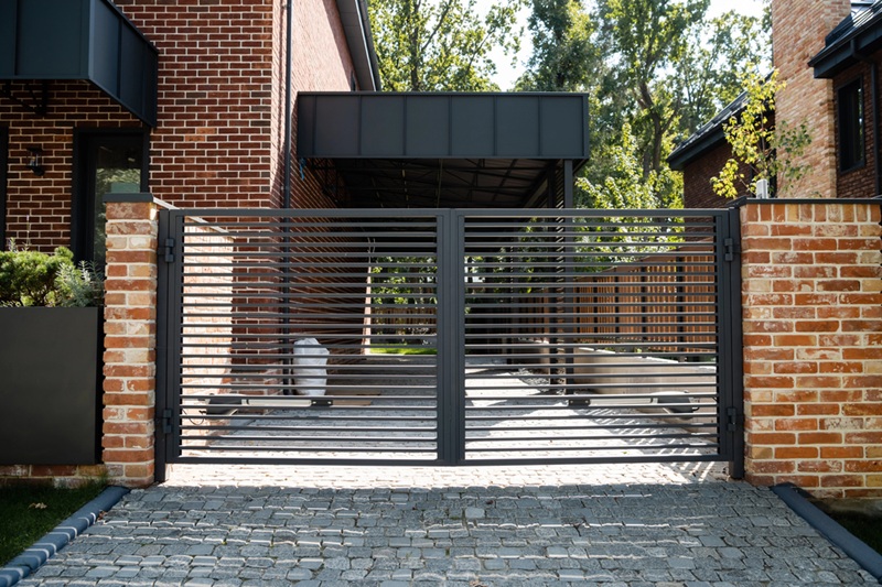 Modern gate in outdoor garage space in house Modern gate in outdoor garage space in house