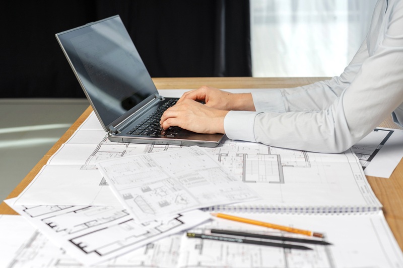 woman working on a blueprint design
