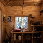 brown wooden table near window