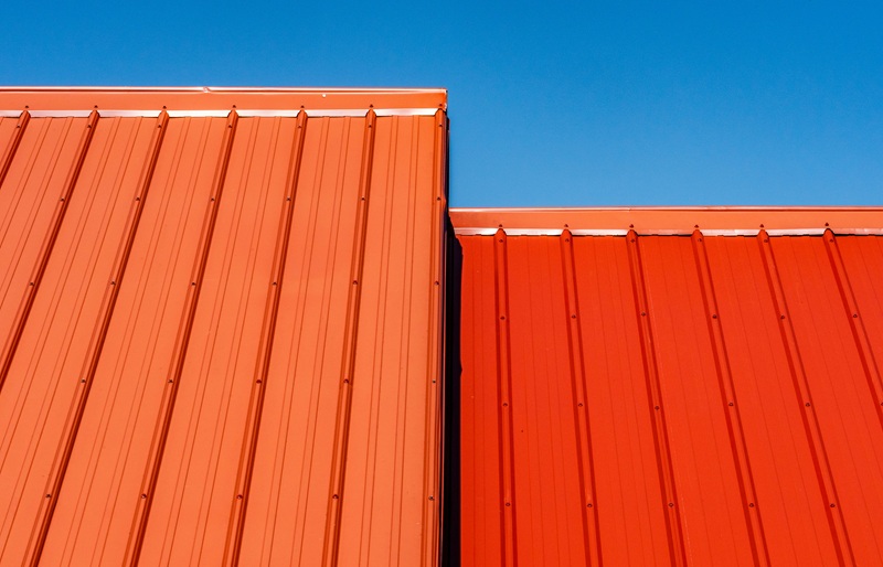 brown wooden wall under blue sky during daytime