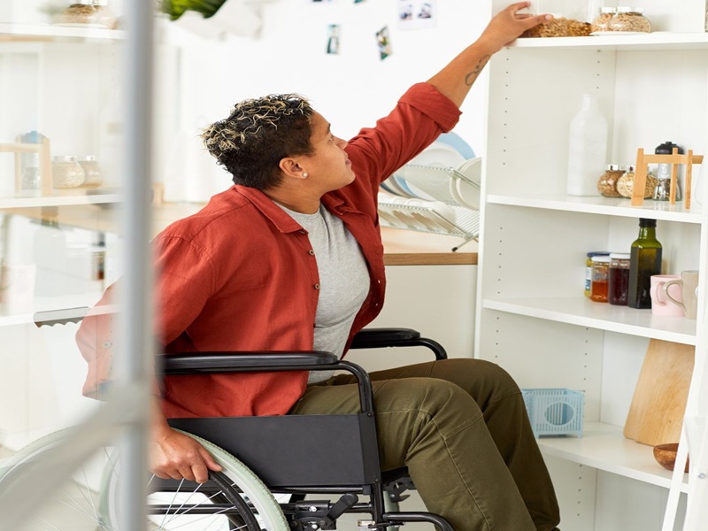 Person in Wheelchair Reaching for Upper Pantry Shelves