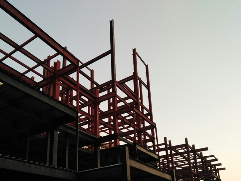 red metal frame under white sky during daytime red metal frame under white sky during daytime